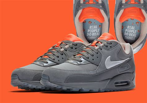 gray nike sneakers|nike grey with orange swoosh.